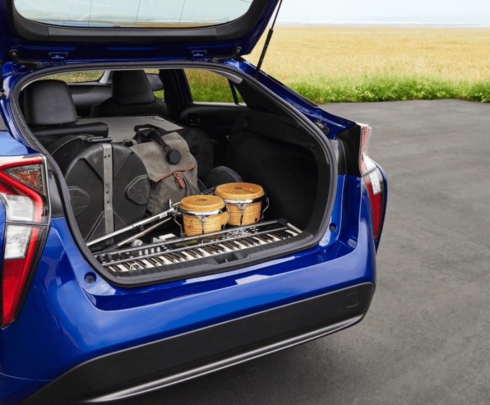 Angular view of the cargo space of the Prius Four in blue. The Prius Four cargo space comfortably holds a number of volume of musical instruments and cases. 