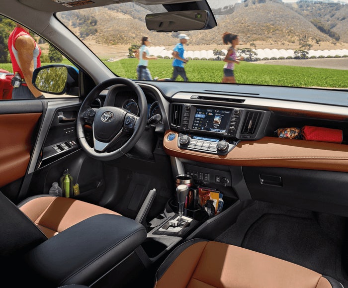 Interior view of the RAV4 Limited Hybrid with Cinnamon Softex interior trim