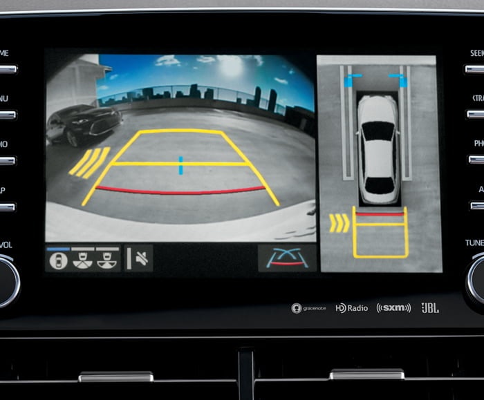 Interior view of 2019 Avalon's dashboard with Rear Cross Traffic Alert with Blind Spot Monitor on screen.