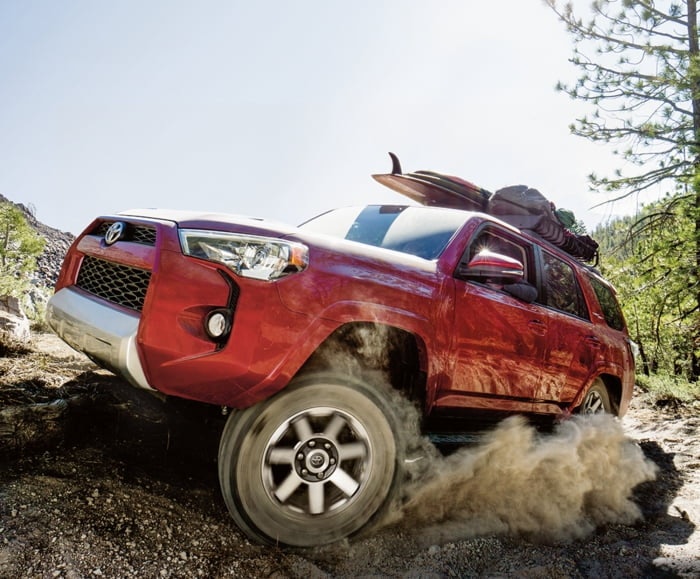 2019 4Runner in Barcelona Red Metallic 3/4 Front Driver Side shot while climbing hill.